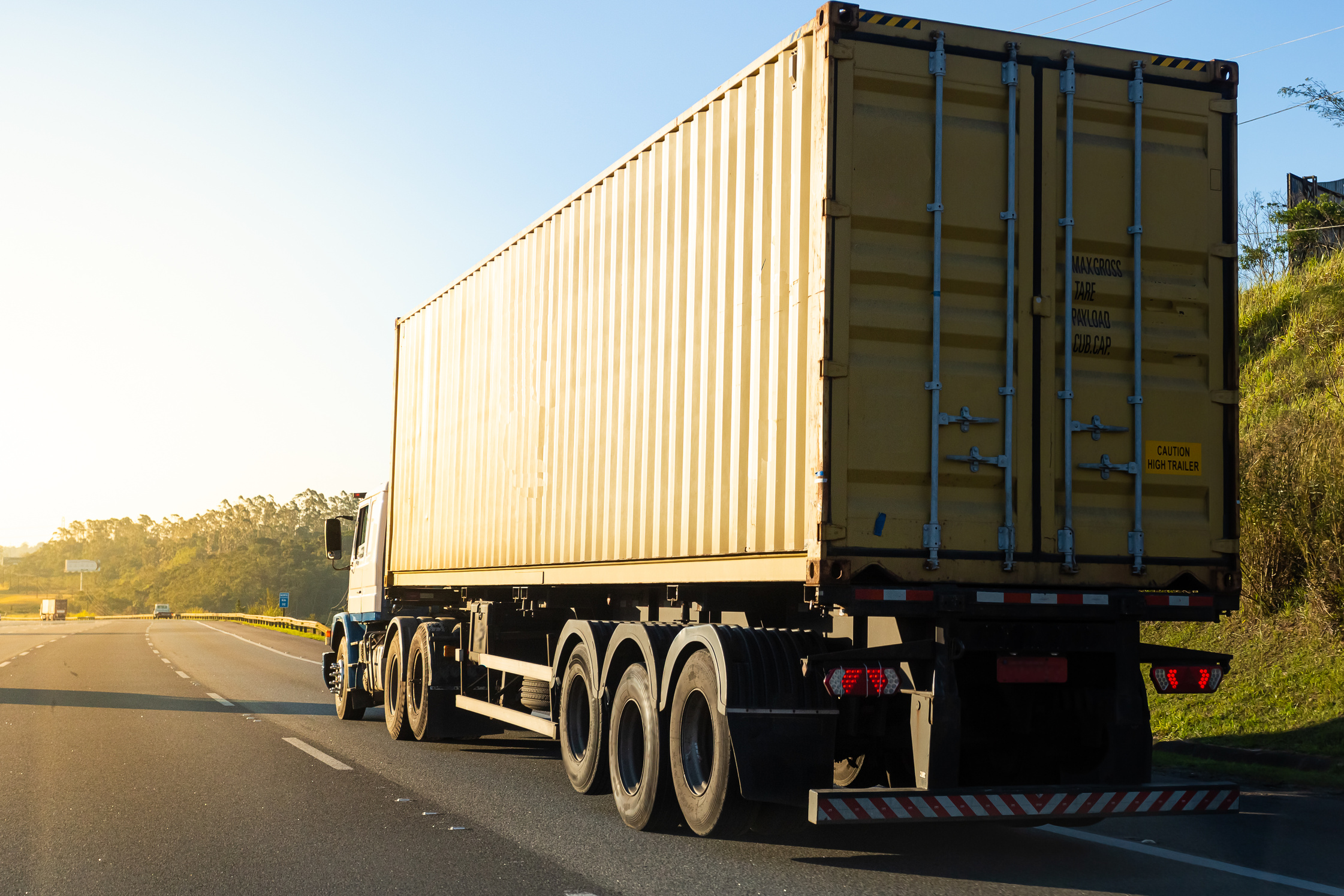 Truck transporting container on the road